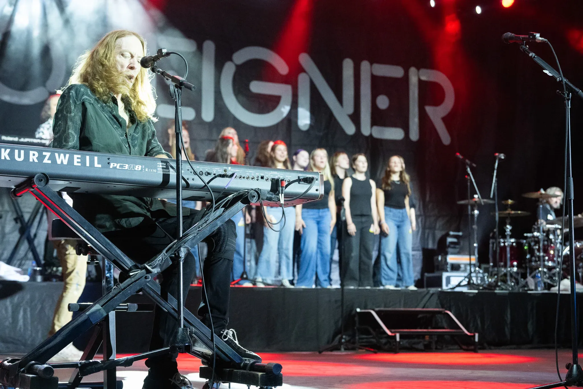 With Jeff Pilson from Foreigner on keys, singers from Walla Walla High School perform during the performance at the Walla Walla County Fairgrounds.