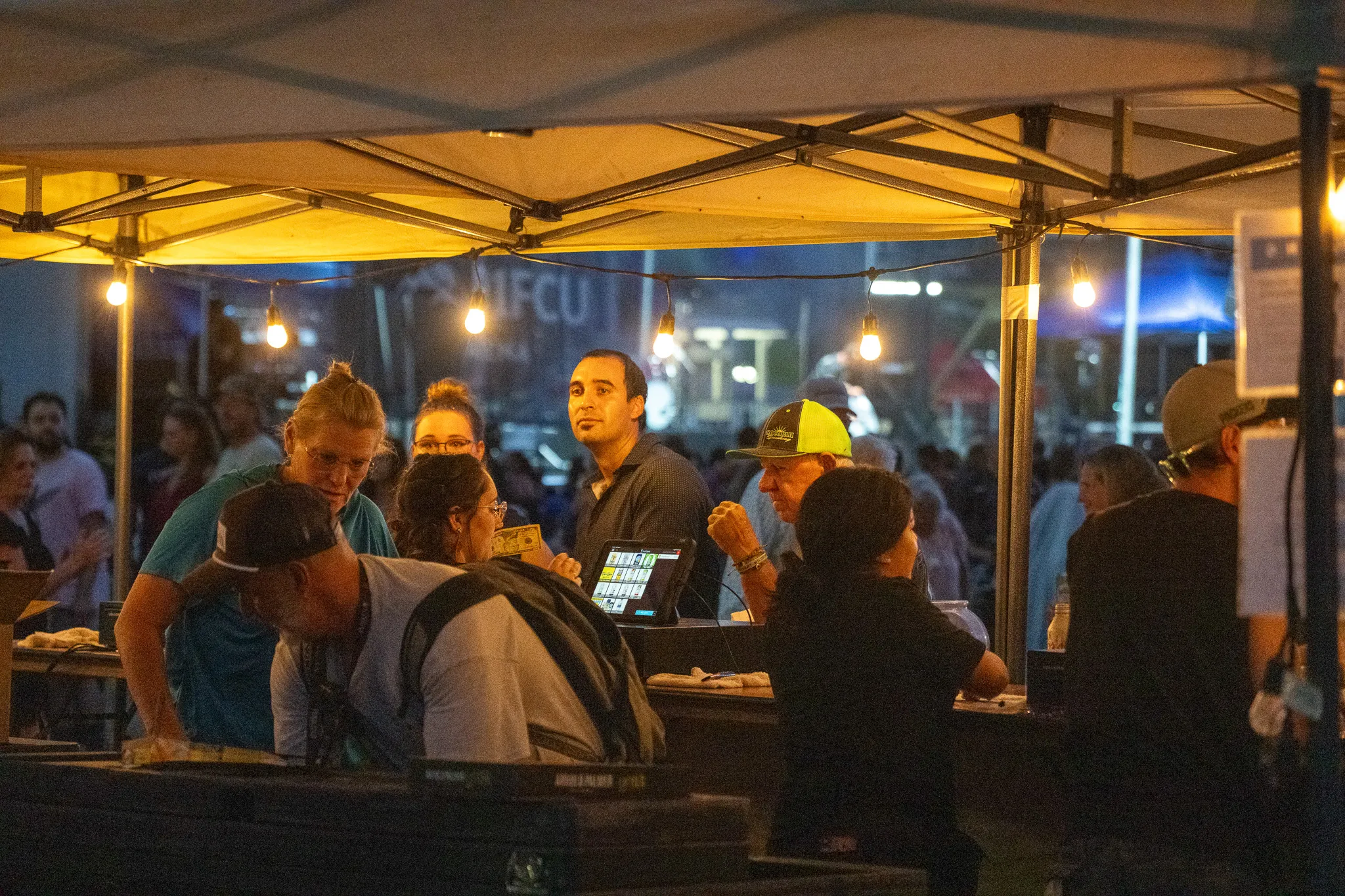 Concert attendees await libation ahead of the performance at the Walla Walla County Fairgrounds.