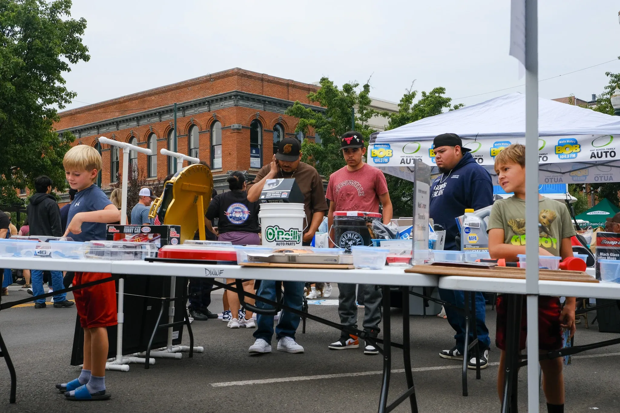 Festival attendees browse model cars for sale at Land Title Plaza during Wheelin' Walla Walla.